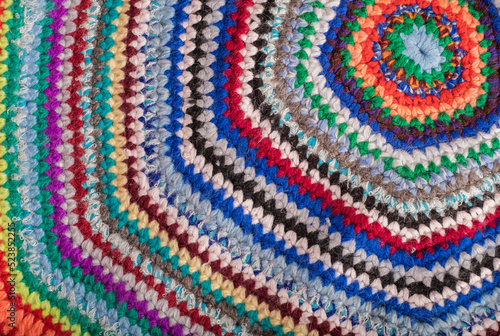 Knitted background from colored threads for knitting. The concept of knitting warm things, rugs