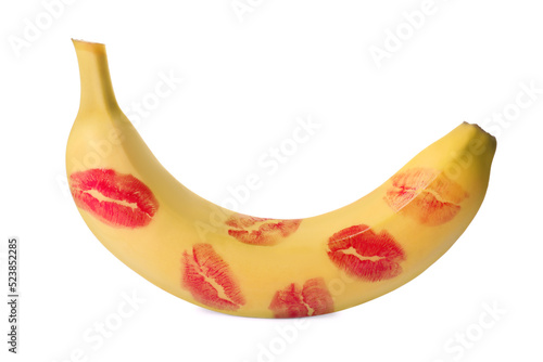 Banana covered with red lipstick marks isolated on white. Potency concept photo