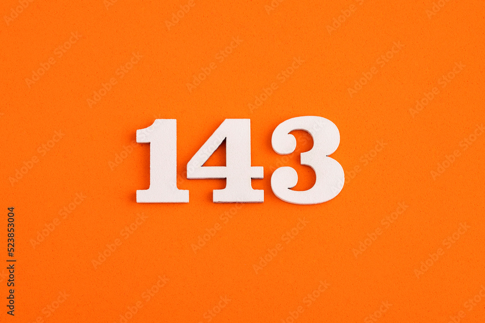 White wooden number 143 on eva rubber orange background White wooden number 143 on eva rubber orange background