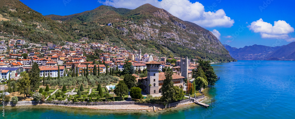 Romantic beautiful lake Iseo, aerial view of Predore idyllic village surrounded by mountains. Italy , Bergamo province
