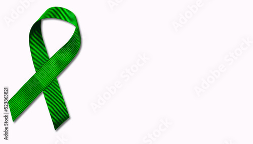 Green ribbon isolated on white background. photo