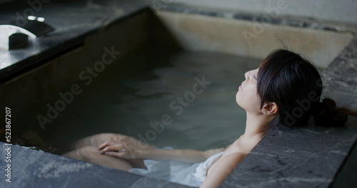 Woman enjoy her hot spring at winter time