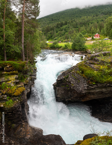 Water of the Valldola river forces itself through the Gudbrandsjuvet ravine, Valldal, Norway photo