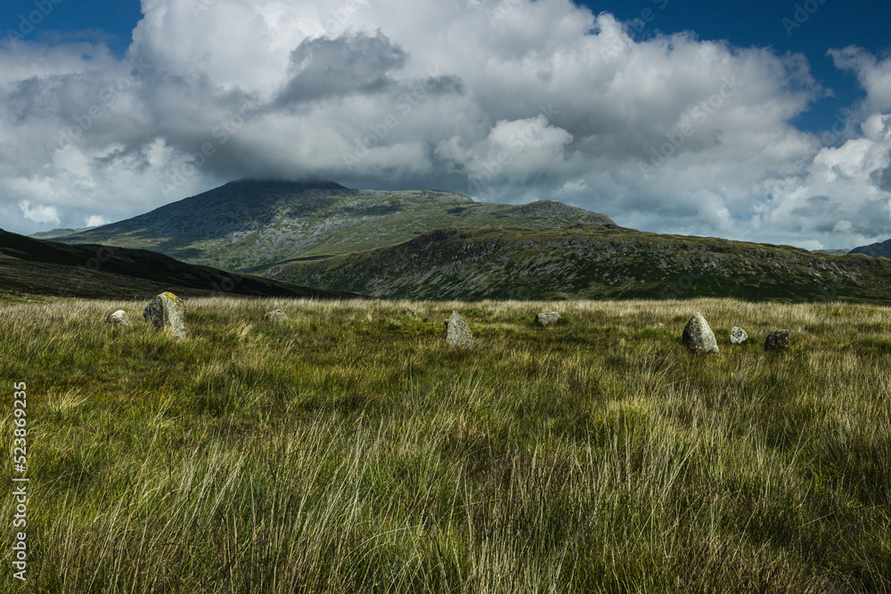Fototapeta premium The stone circle on Brats Hill, Eskdale seem to line up with Scafell, Long Gree and Slight Side across the Eskdale Valley