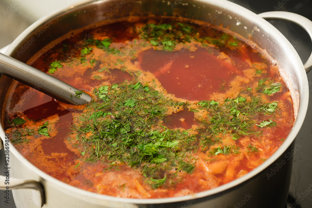 Pot of freshly cooked ukrainian borscht on a kitchen stove. Pot of freshly cooked ukrainian borscht on a kitchen stove.