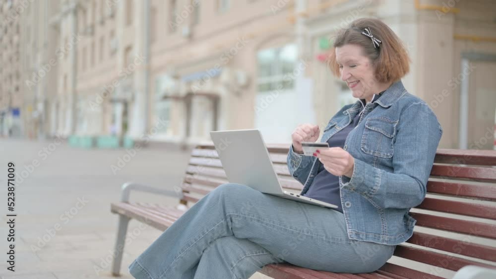 Old Woman making Successful Online Payment on Laptop Old Woman making Successful Online Payment on Laptop