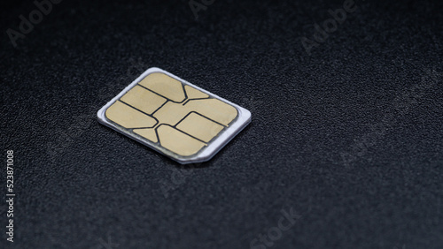sim card for mobile phone on black background photo