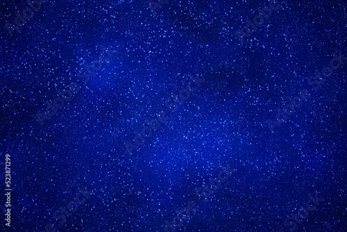 Starry night sky background. Blue galaxy space with glowing stars. 
