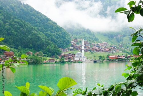 foggy day in Uzungöl - Uzungöl district, Çaykara - Trabzon, Turkey - The lake is situated south of the city of Trabzon in the Black Sea region of Turkey and a tourist magnet destination.  photo
