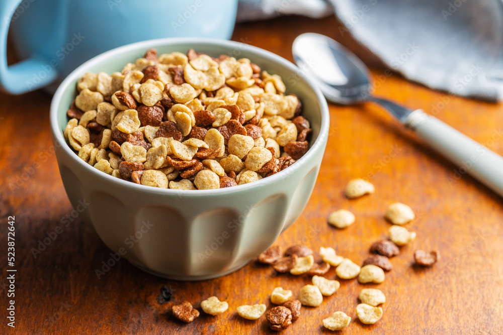 Breakfast cereal flakes in bowl. Breakfast cereal flakes in bowl.