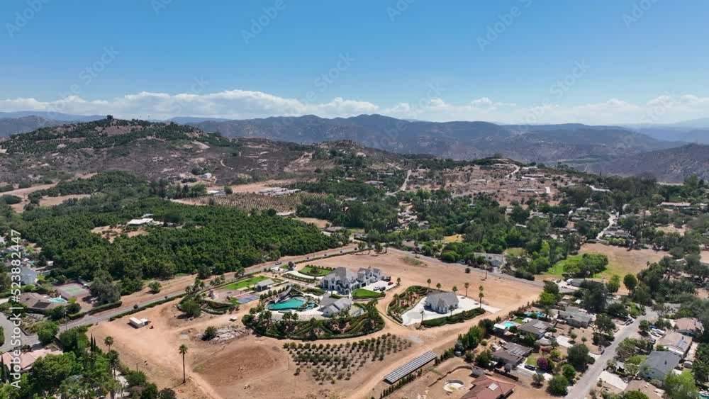 Aerial view of dry valley and land with houses and barn in Escondido, San Diego, California Aerial view of dry valley and land with houses and barn in Escondido, San Diego, California