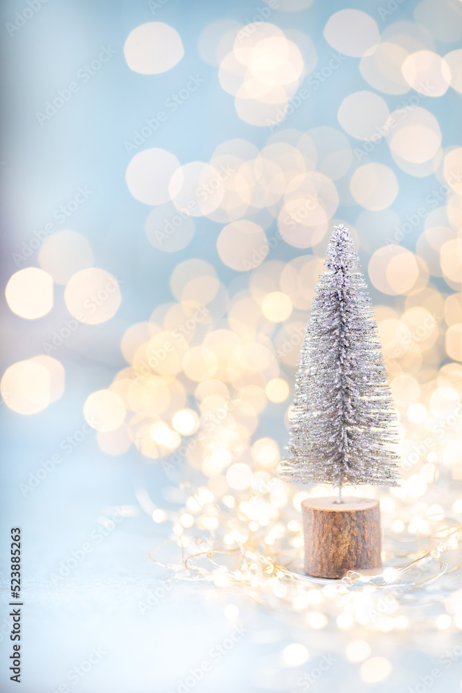 Christmas spruce with tree and blurred shiny lights.