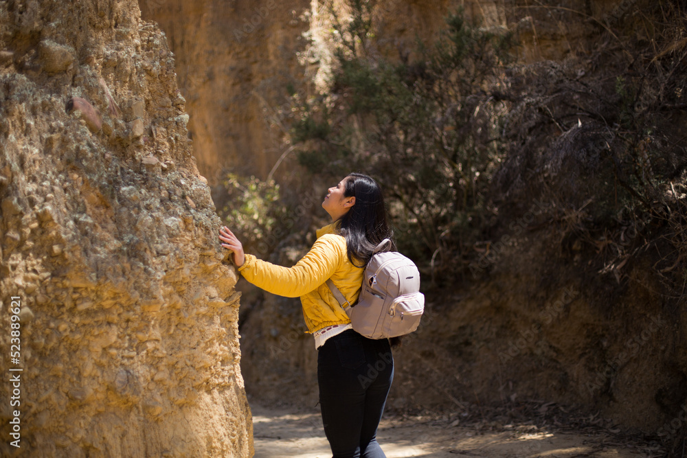 Young female tourist on ruins in peru. Concept of travel, tourism and vacations. Young female tourist on ruins in peru. Concept of travel, tourism and vacations.
