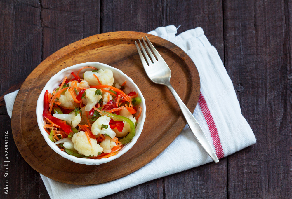 Homemade pickled food, colorful salad of mixed vegetables ready for winter.