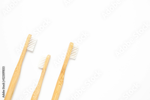 Wooden toothbrushes on a white background  top view. Zero waste concept.