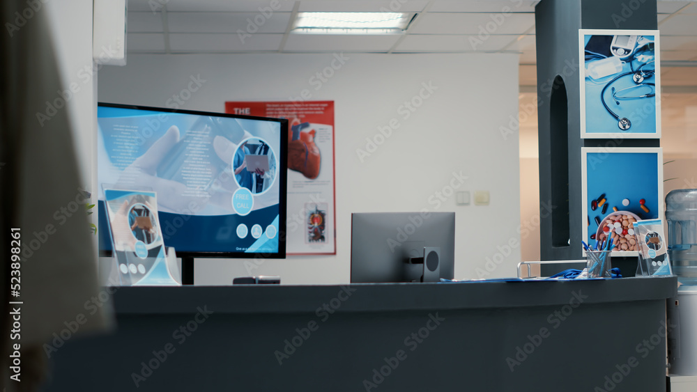 Nobody working at empty reception desk in waiting room to support healthcare appointments for consultation and examination. Hospital lobby with waiting area seats at medical facility. Nobody working at empty reception desk in waiting room to support healthcare appointments for consultation and examination. Hospital lobby with waiting area seats at medical facility.