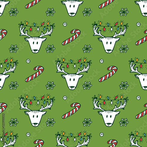 Holiday seamless pattern with Christmas reindeer and Christmas candy sticks. Hand drawn doodle vector illustration