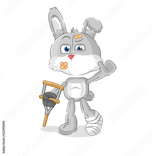 rabbit sick with limping stick. cartoon mascot vector