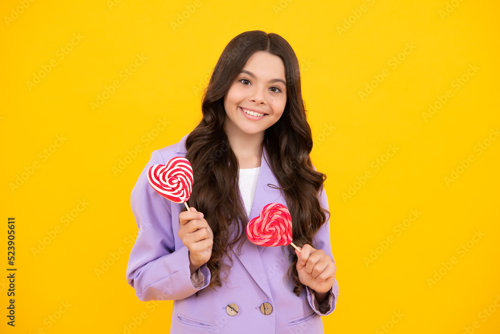 Cool teen child with lollipop over yellow isolated background. Sweet childhood life. Teen girl with yummy lollipop candy. Happy teenager, positive and smiling emotions of teen girl. Cool teen child with lollipop over yellow isolated background. Sweet childhood life. Teen girl with yummy lollipop candy. Happy teenager, positive and smiling emotions of teen girl.