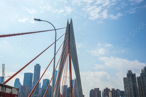 Top of the Qiansimen Bridge against the cityscape under the blue sky in China photo