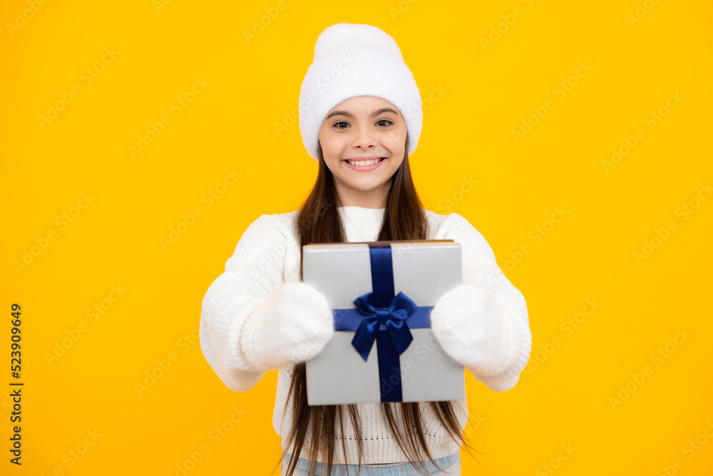 Teenager child with gift box, studio isolated background. Present for winter birthday, Valentines day, New Year or Christmas. Kid hold present box with gift ribbon bow. Teenager child with gift box, studio isolated background. Present for winter birthday, Valentines day, New Year or Christmas. Kid hold present box with gift ribbon bow.