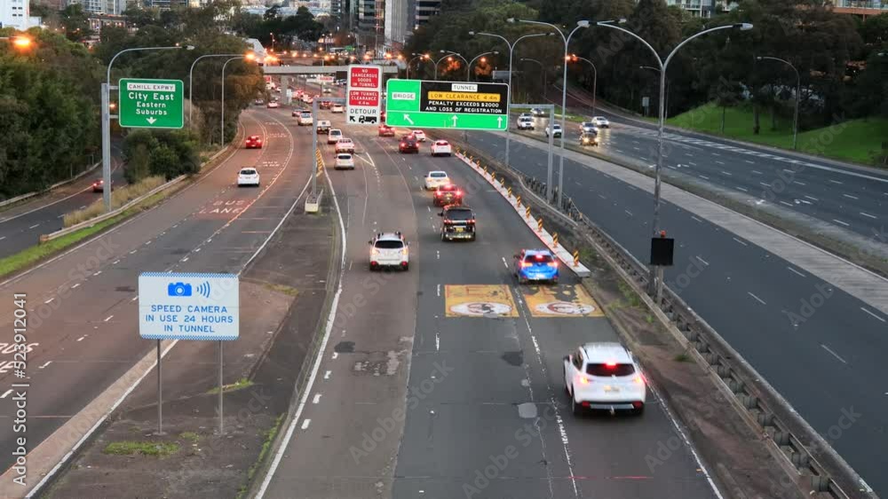Urban cityscape of Sydney city around Motorway at sunset with lights 4k.
Urban cityscape of Sydney city around Motorway at sunset with lights 4k.