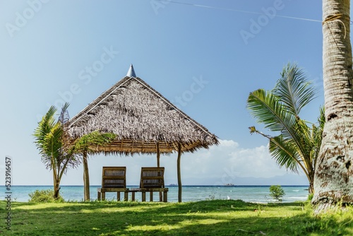 Open-air bungalow with two chairs on the Romblon beach, the Philippines photo