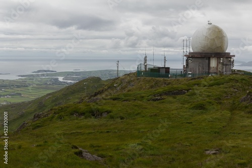 Irish Aviation Authority radar tracking installation on a green hill in Ireland, United Kingdom