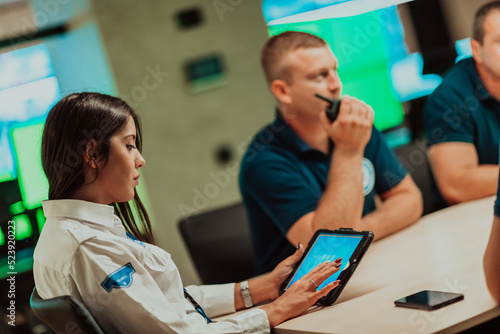 Εκτύπωση καμβά Group of security guards sitting and having briefing In the system control room