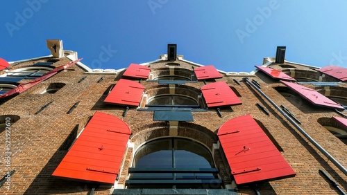 Photography Low-angle view of the shutters on the houses of the canals in Amsterdam