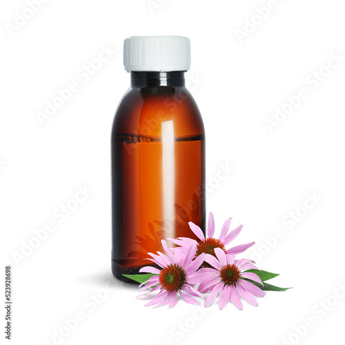 Bottle of echinacea syrup and flowers on white background