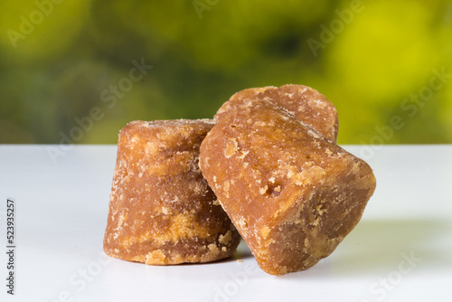 panela cubes or sugar cane candy on a nature background with copy space, typical food from Colombia photo