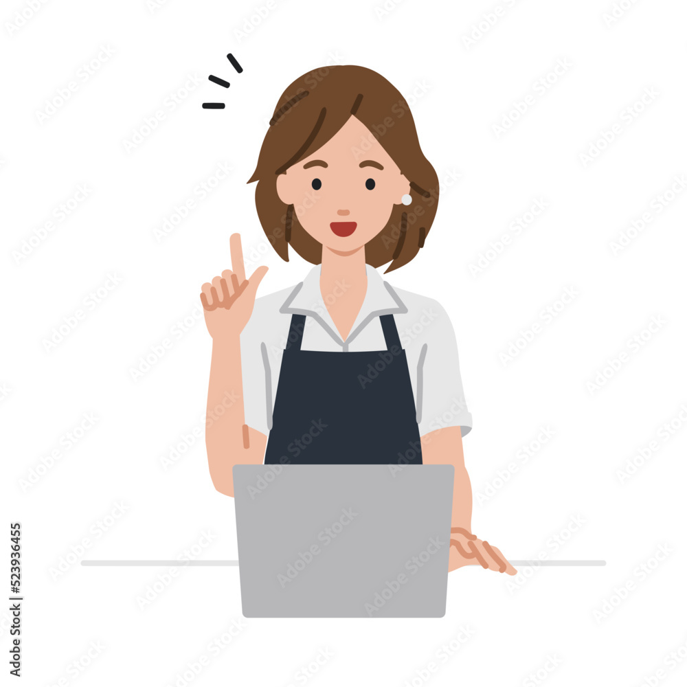 デスクで座ってPCを開いて何かひらめいた店員の女性