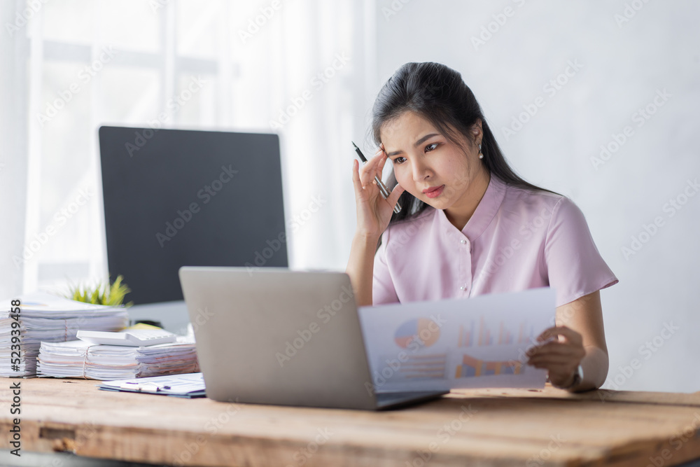 Stress people Asian business woman and work concept, a tired Asian businessman in workplace office desk.
Stress people Asian business woman and work concept, a tired Asian businessman in workplace office desk.