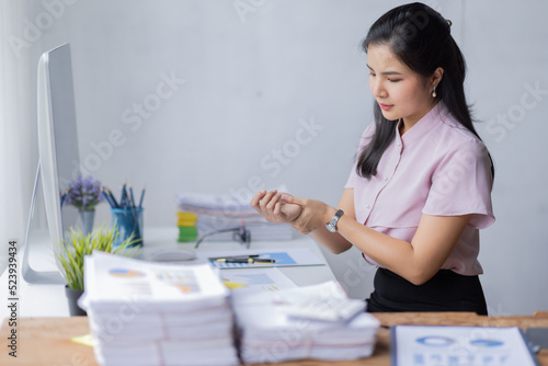 Stress people Asian business woman and work concept, a tired Asian businessman in workplace office desk.

