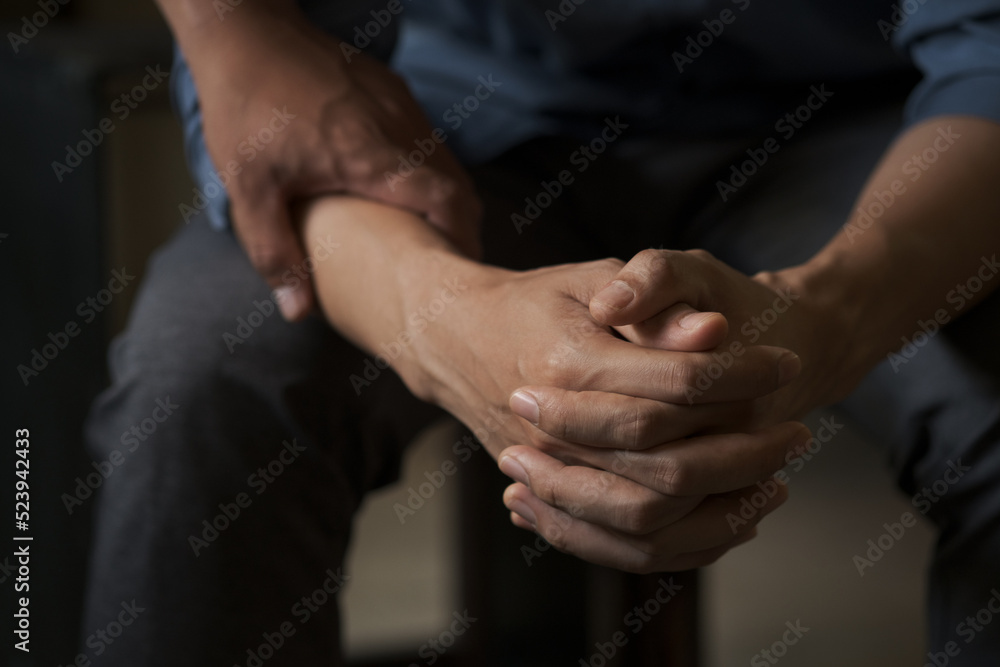 Christian couple holding hands. Two people are praying together. pray together, Hands folded in prayer concept for faith.