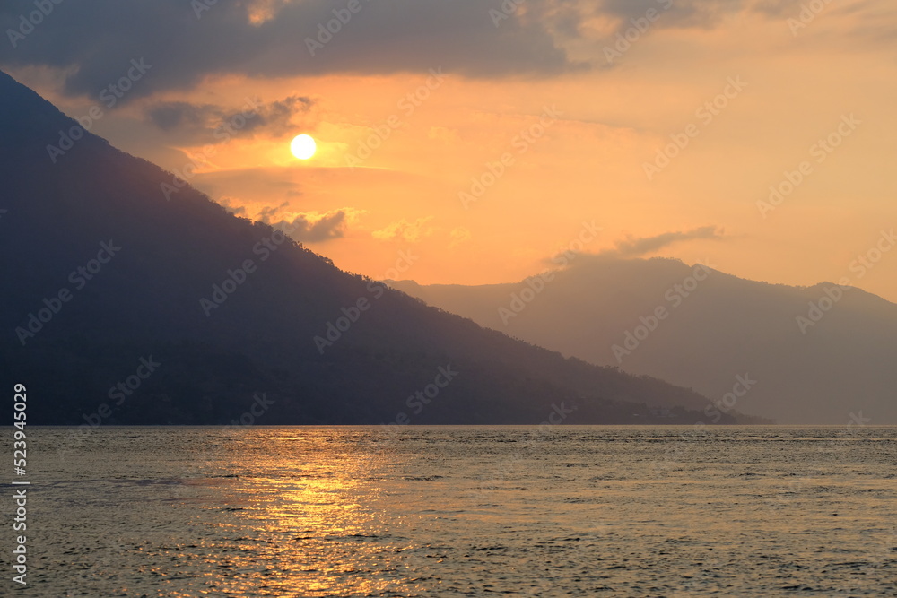 Indonesia Alor Island - Seascape with volcanic mountain in the sunset