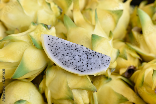 Yellow dragon fruit healthy weight loss fruit. It is a plant in family as cactus. or food for pay respect to predecessor god Chinese new year festival. Chinese culture ancestor food offering. photo