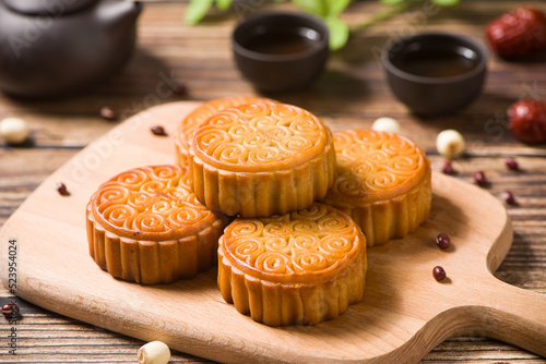 Traditional Chinese mid autumn festival mooncake on wooden table