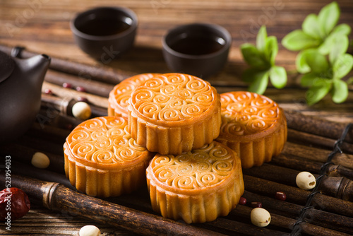 Traditional Chinese mid autumn festival mooncake on wooden table photo