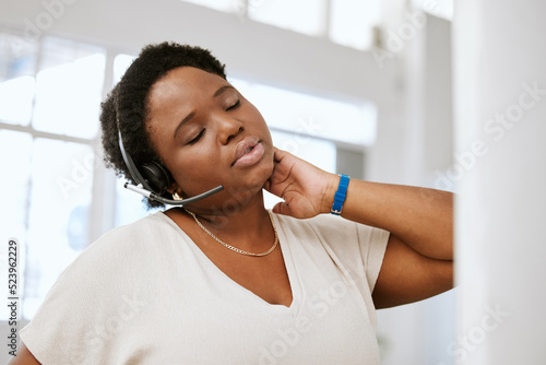 Εκτύπωση καμβά Stressed, neck pain and tired call center agent stretching bad, strained or sore muscle while working with headset