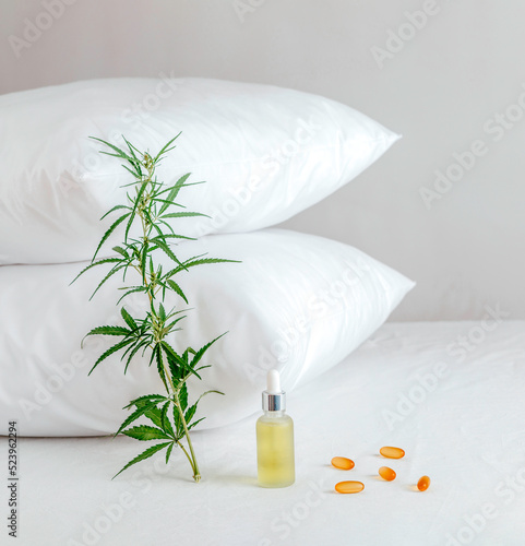 Pharmaceutical medicine pills, capsules and cbd oil on the bed. Concept sleep disorder. beat insomnia and restore sleeping routine.