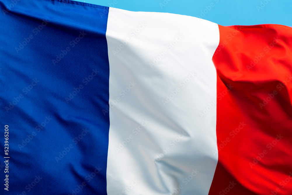 Obraz premium French flag waving on blue background