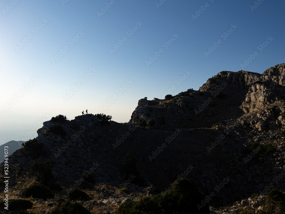 tiny looks of people in peak mountains tiny looks of people in peak mountains
