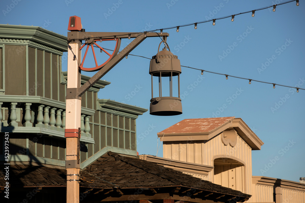 Late afternoon view of a light post framing the historic Old Town of Scottsdale, Arizona, USA.