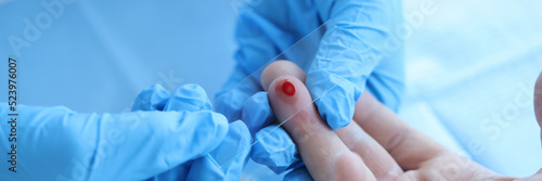 Fototapeta Doctor takes blood sample of patient serological test for PRP blood antibodies