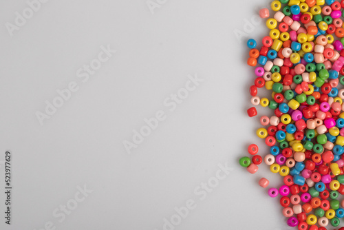 Wallpaper Mural Assorted colored plastic beads on a white background. Torontodigital.ca