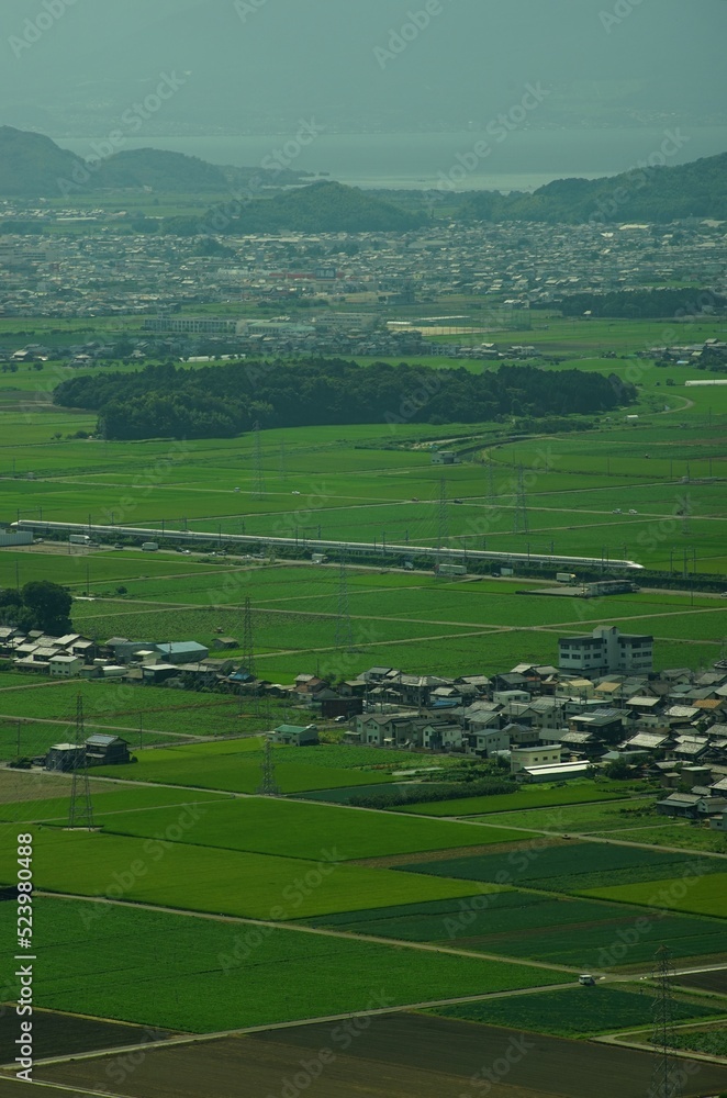 N700A running on Tokaido Shinkansen line in countryside N700A running on Tokaido Shinkansen line in countryside