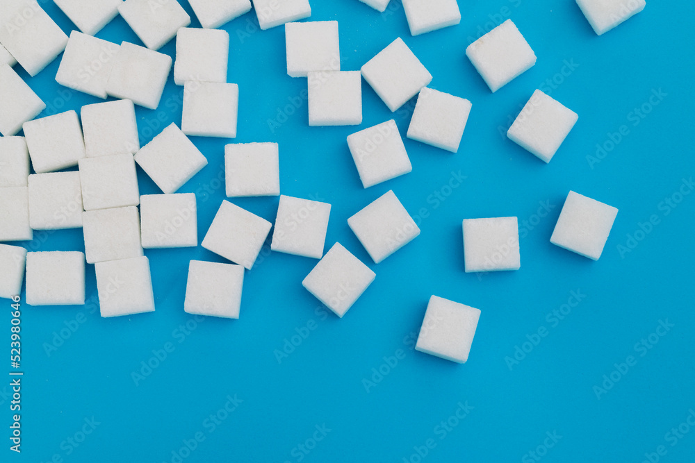 Sugar cubes on blue background Sugar cubes on blue background