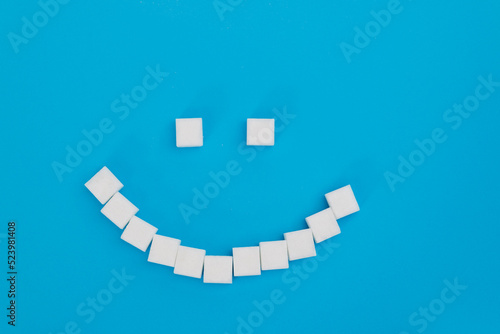 Smile face made of sugar cubes